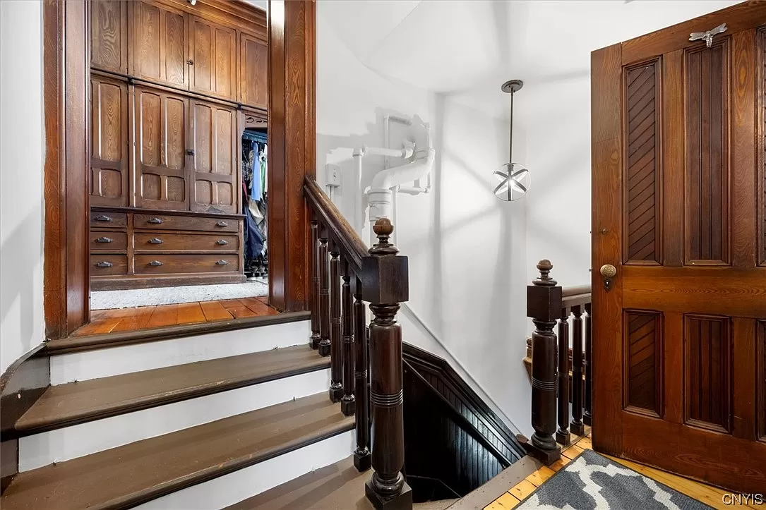 short staircase to closet with built-in storage