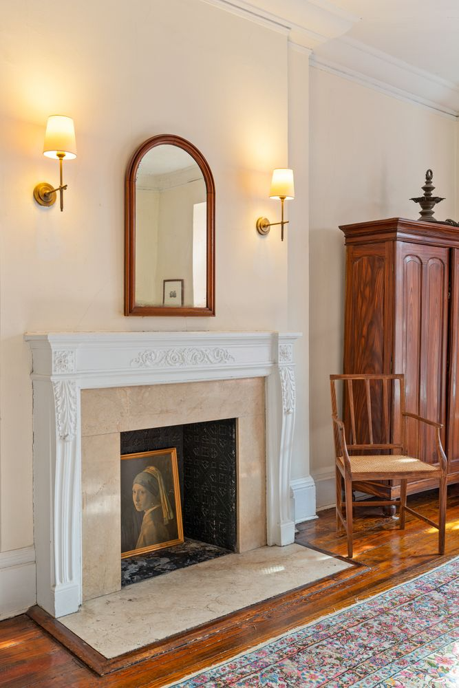 white mantel with stone surround