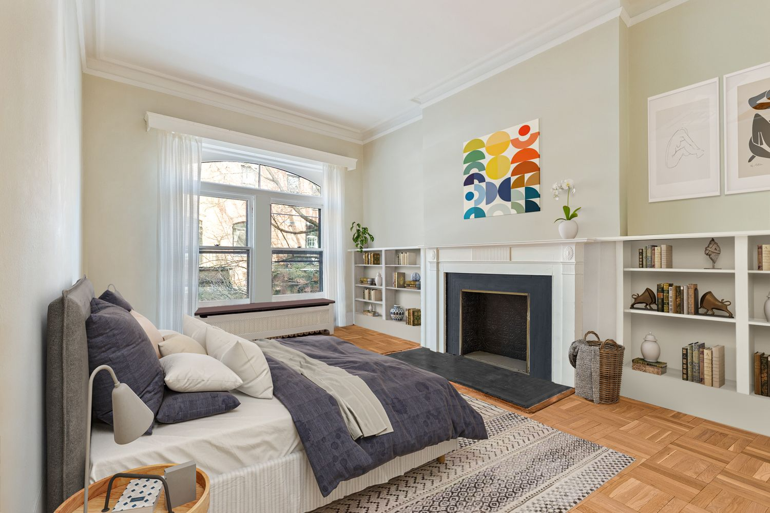 virtually staged bedroom with mantel and built-in bookshelves