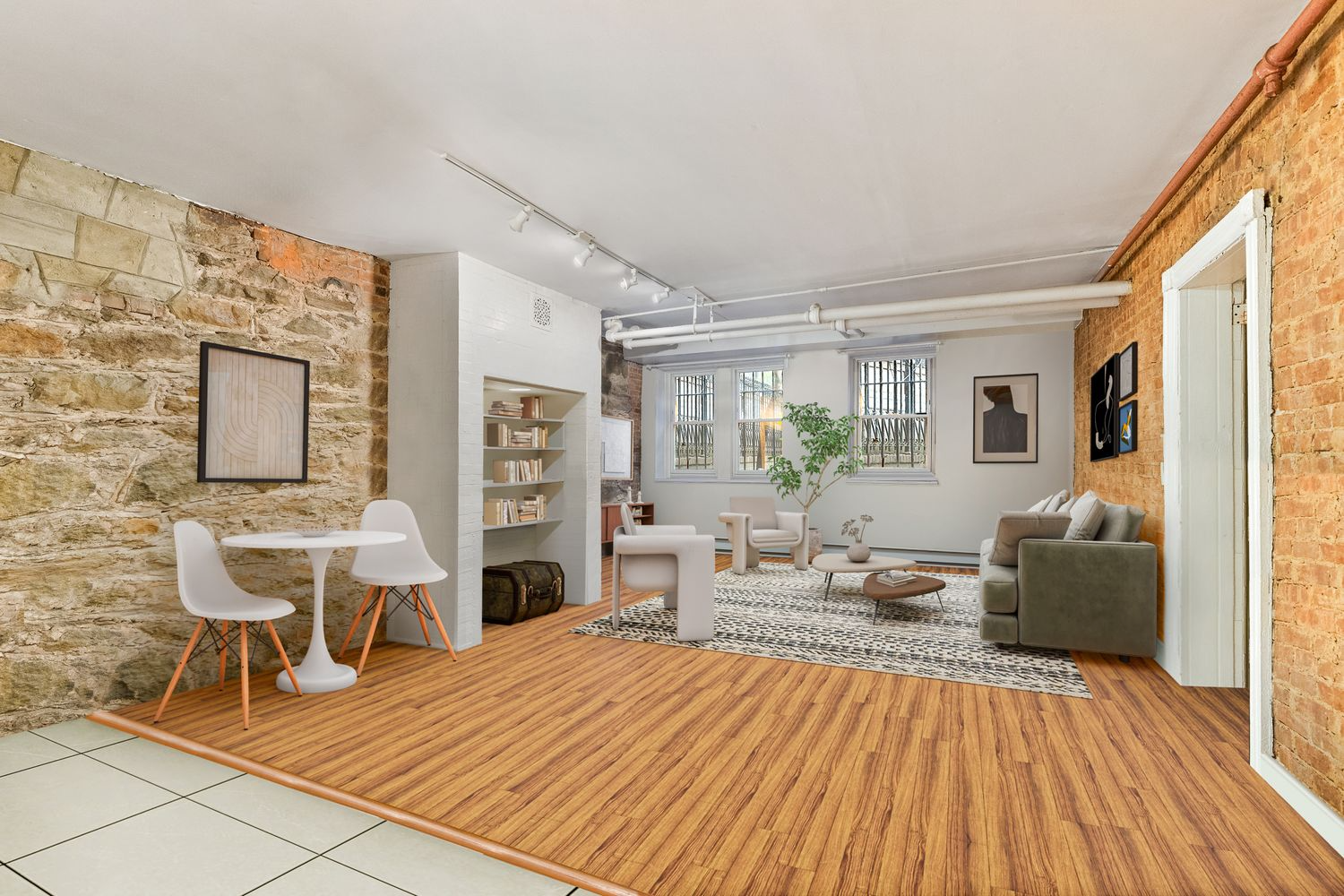 garden level apartment staged with sofa and table for dining