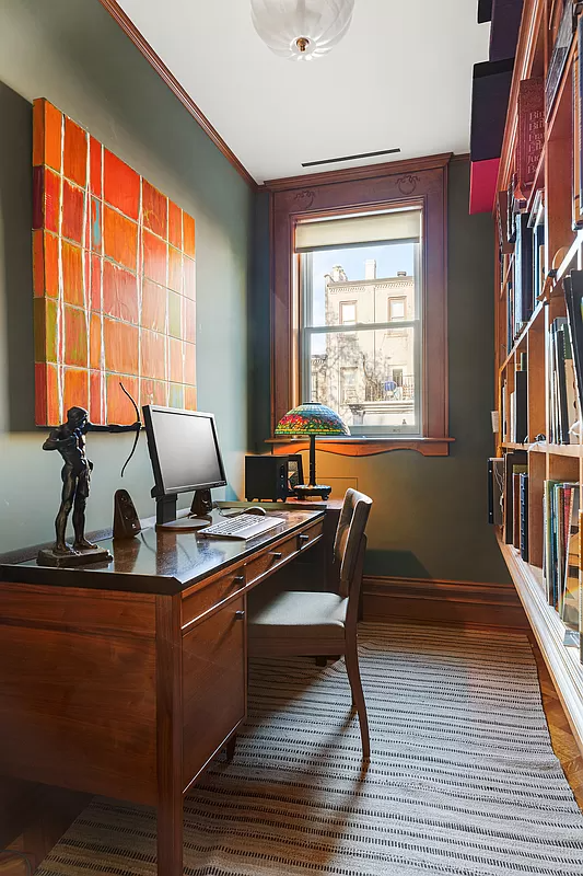 narrow office with bookshelves