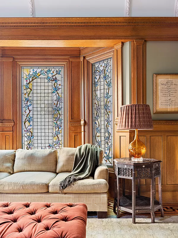 stained glass windows with a foliate design in the living room