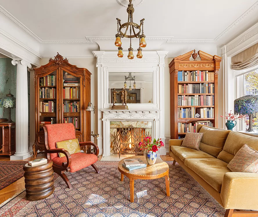 park slope - parlor with white mantel and a columned divider