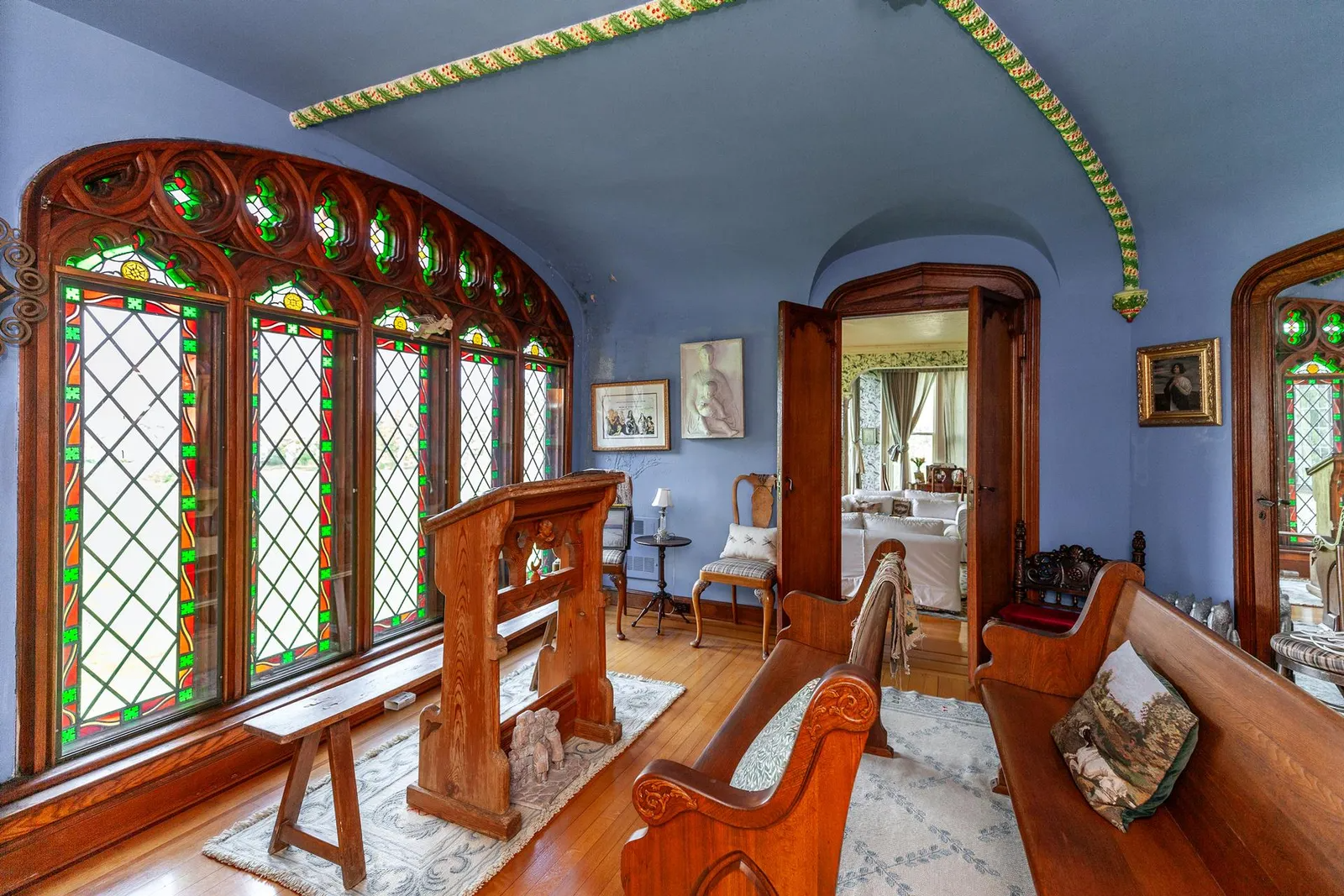 room with stained glass windows and wood floor