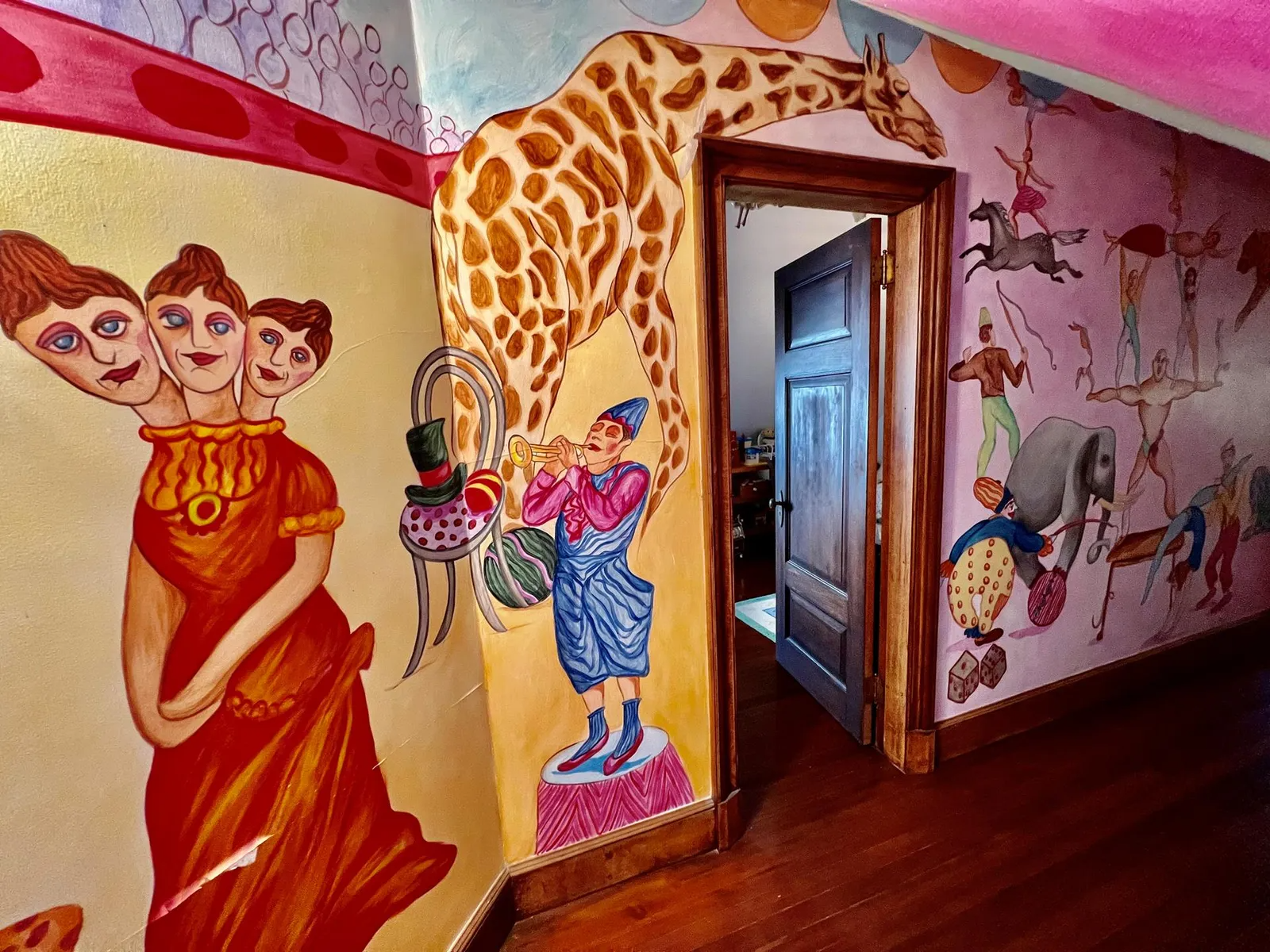 hand painted circus themed illustrations along several walls
