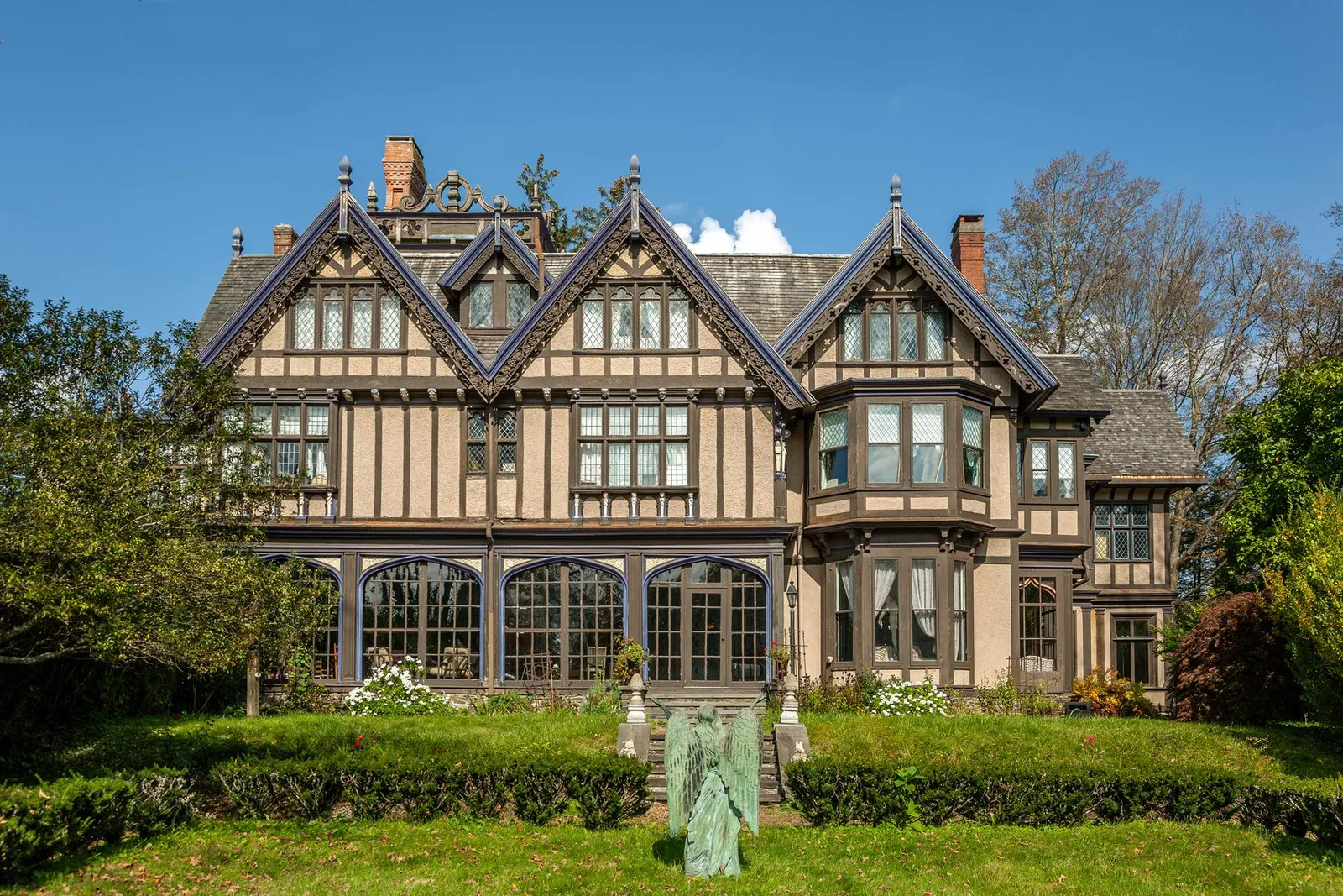 exterior showing arched windows of enclosed porch