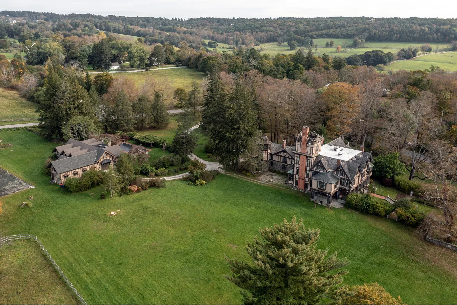 aerial showing multiple buildings on property