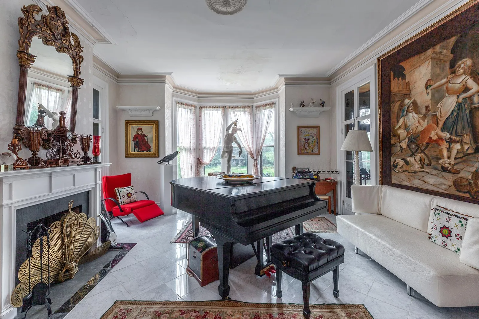music room with tiled floor and white mantel
