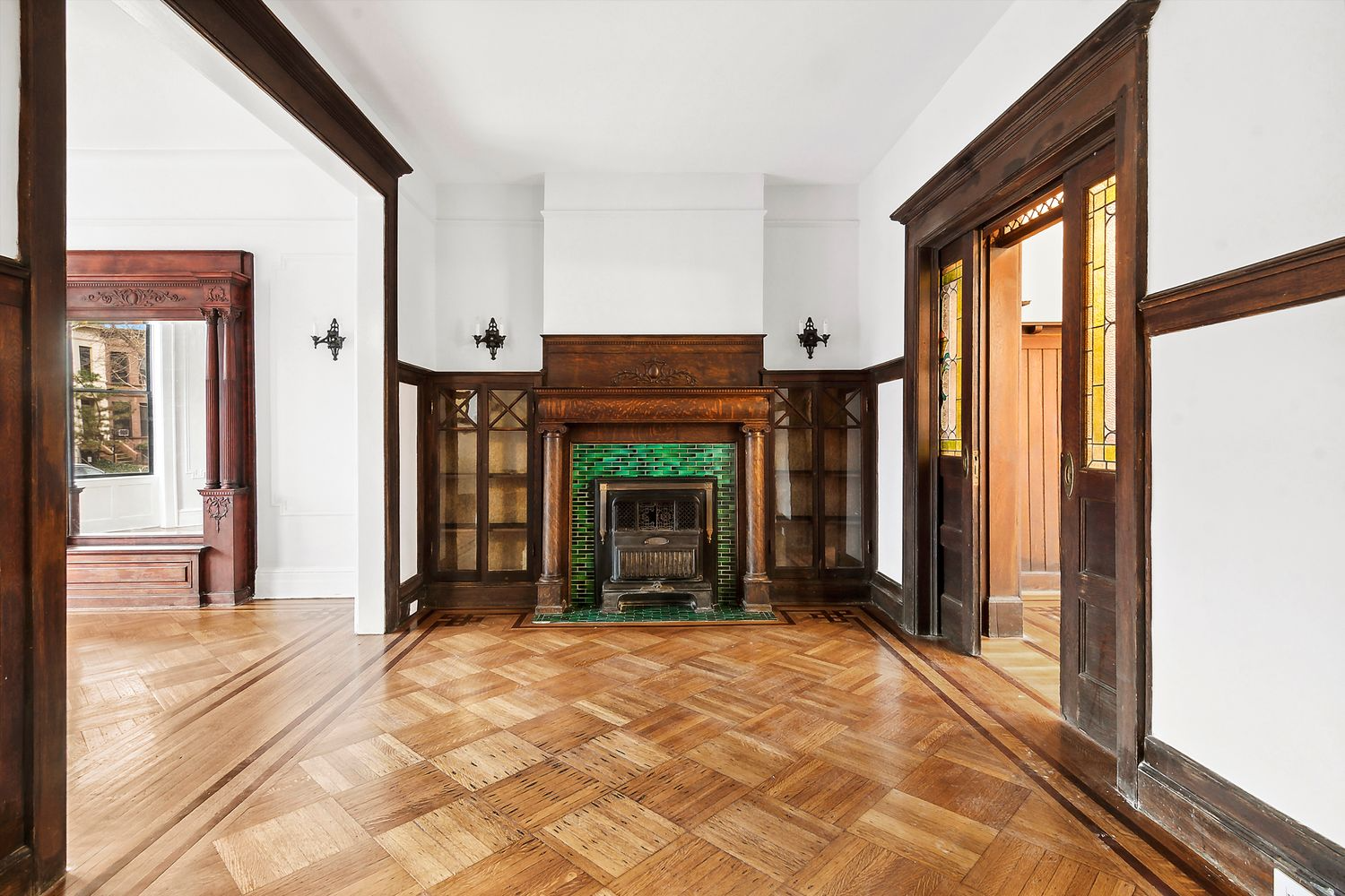 middle parlor with mantel and built-in bookshelves