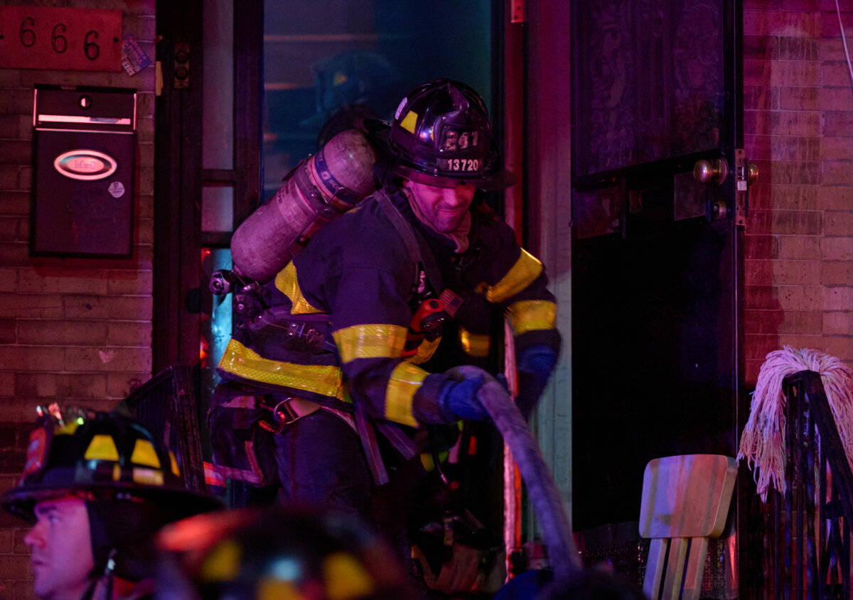 sunset park - firefighter outside a building