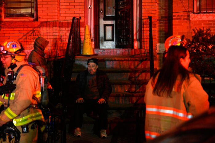 a person sitting on a stoop 