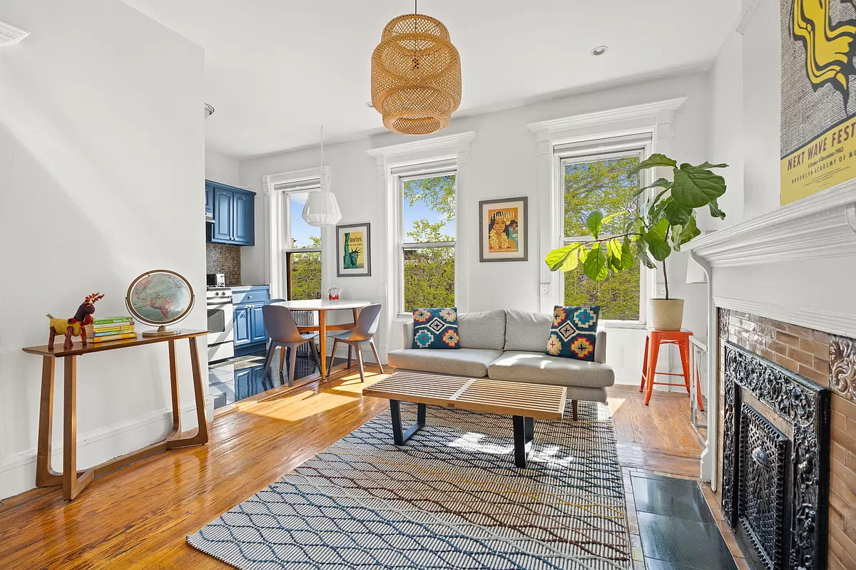 living room with view to kitchen with blue cabinets