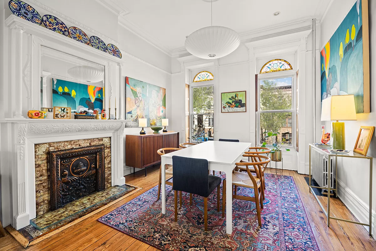 dining room with a mantel with original tile surround