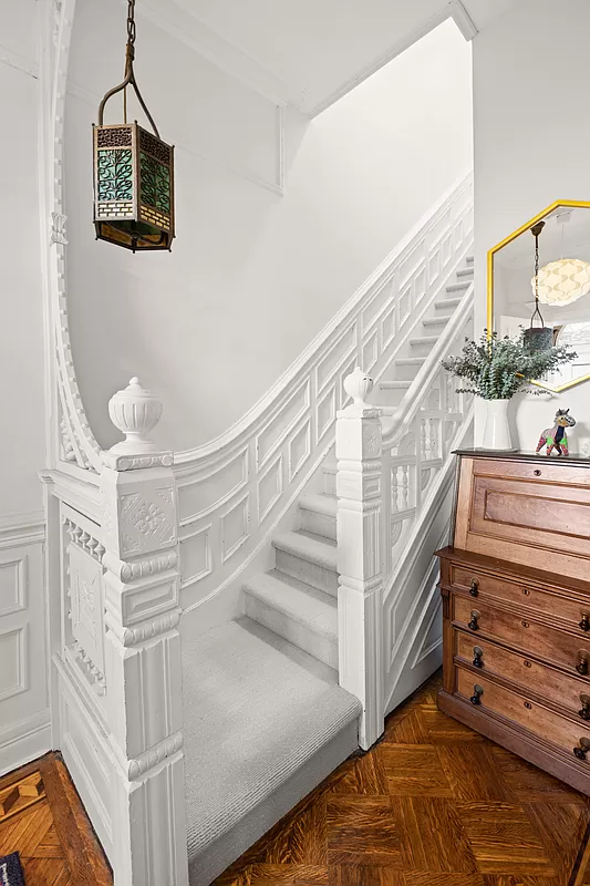 entry with white painted original stair
