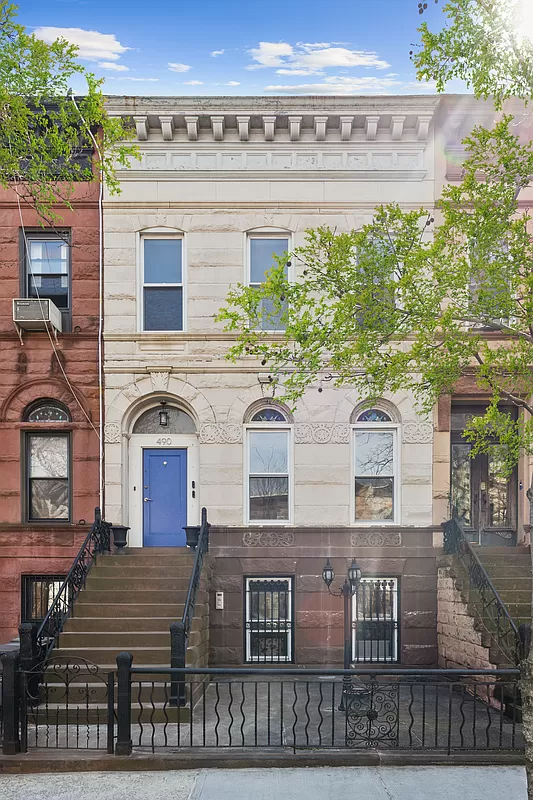 exterior with a stoop and a bright blue door