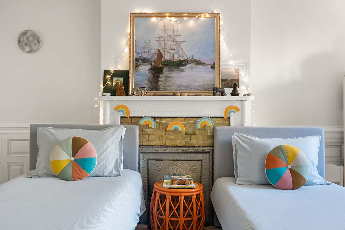 bedroom with a mantel and tile surround