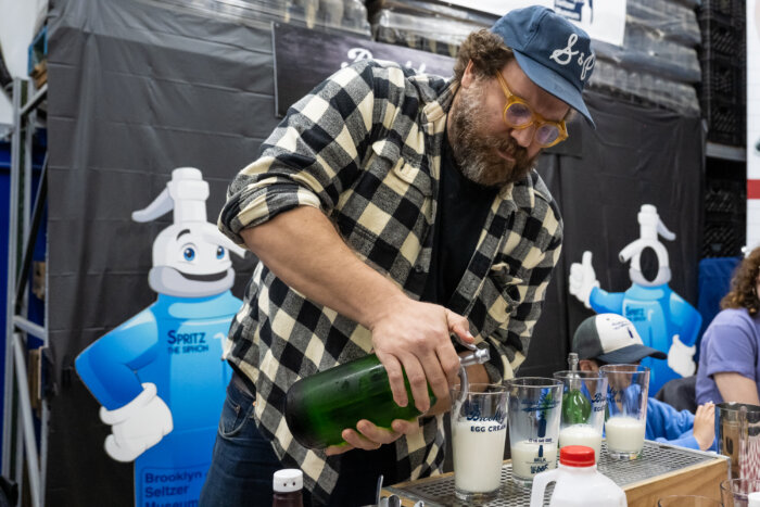 adding seltzer to an egg cream