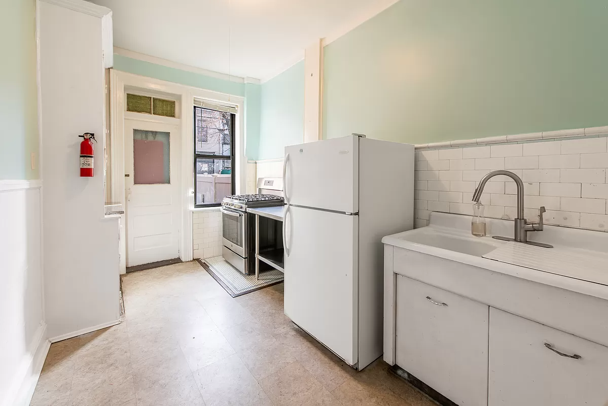 kitchen with white subway tile, vintage sink