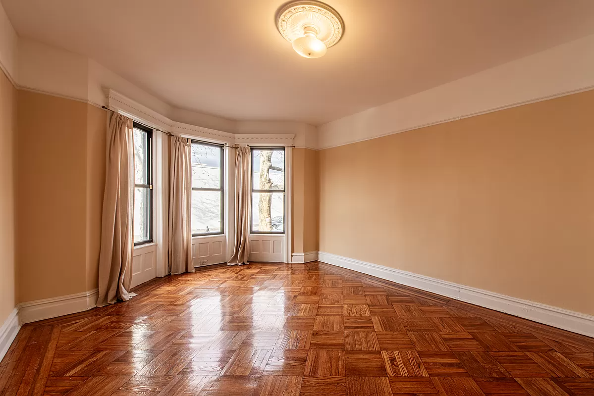 living room with picture rail, wood floors