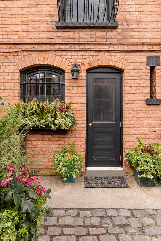 rear door with window box at adjoining window