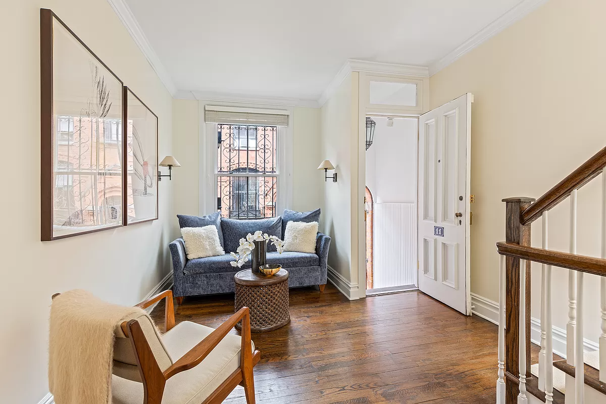 living room at front entrance with wood floor and stair