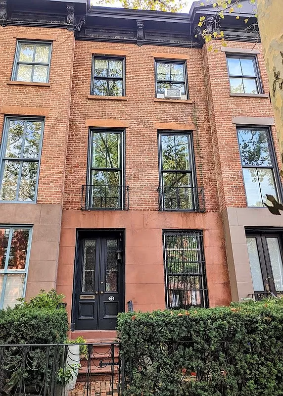 brick and brownstone exterior of the row house