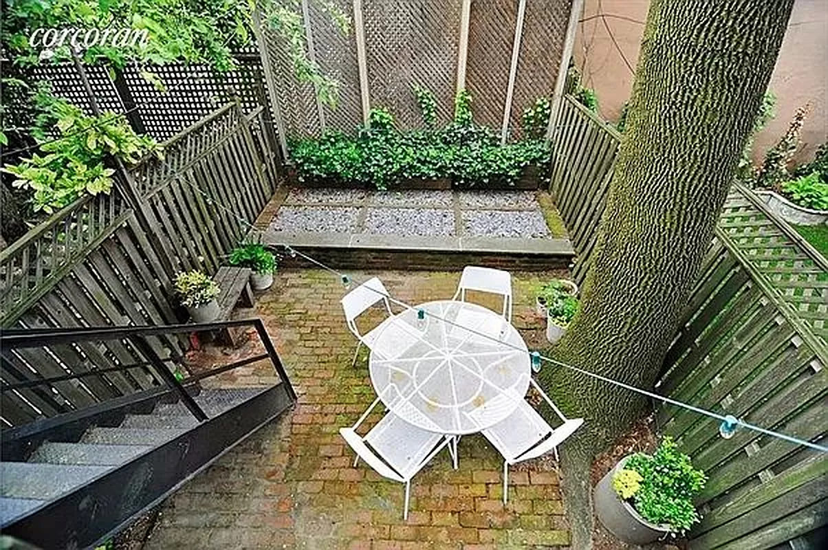 rear yard with brick paved patio