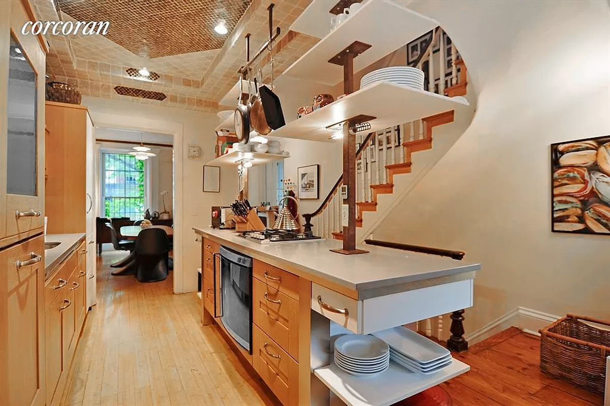 kitchen in middle of the parlor floor with wood cabinets