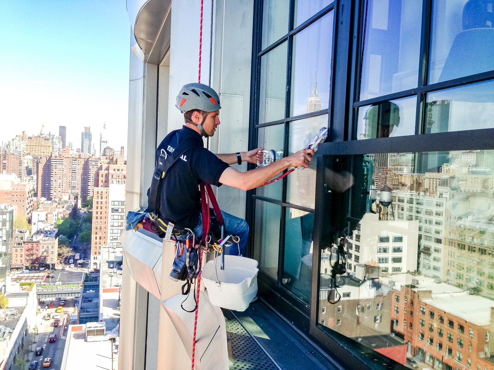 total window service up in the sky cleaning a window