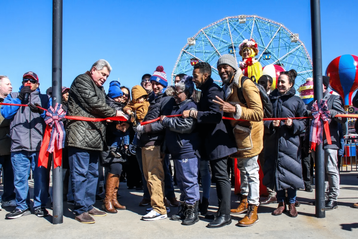 coney island - people cutting a red ribbon