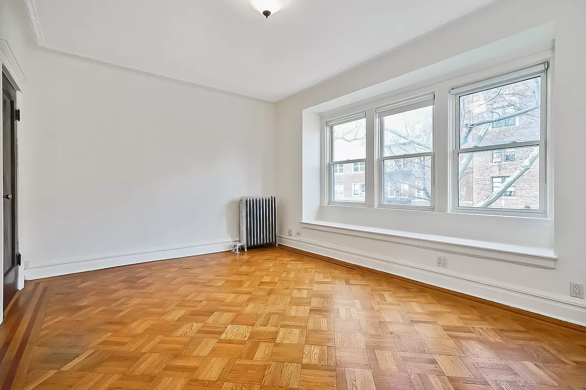 bedroom with three windows