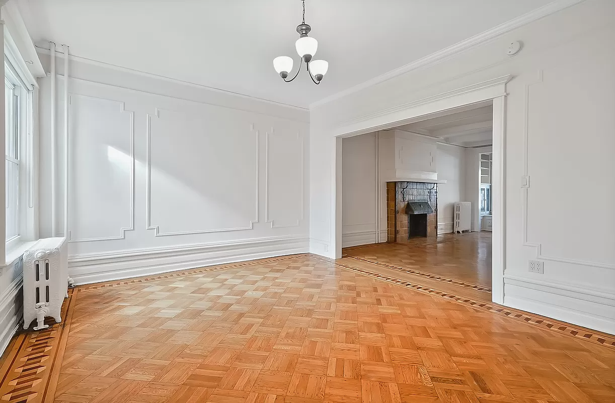 dining room with wall moldings and wood floor