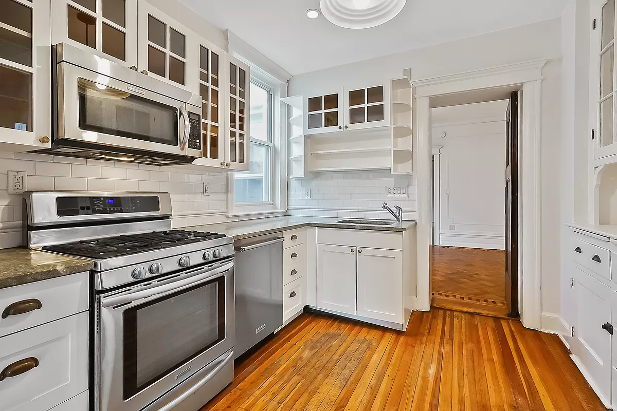 kitchen with white cabinets and white subway tile backsplash