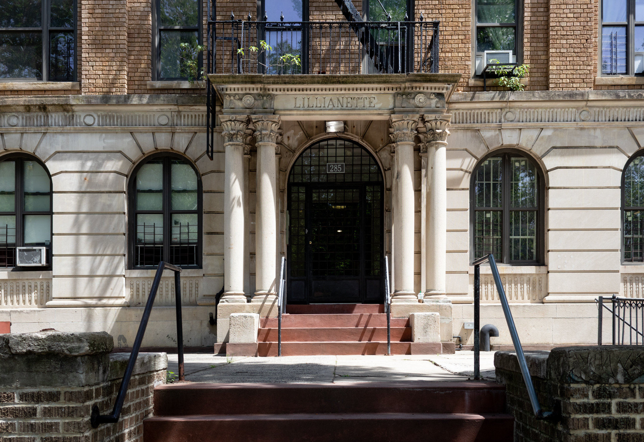 columned entry to the building with "lillianette" carved above the door