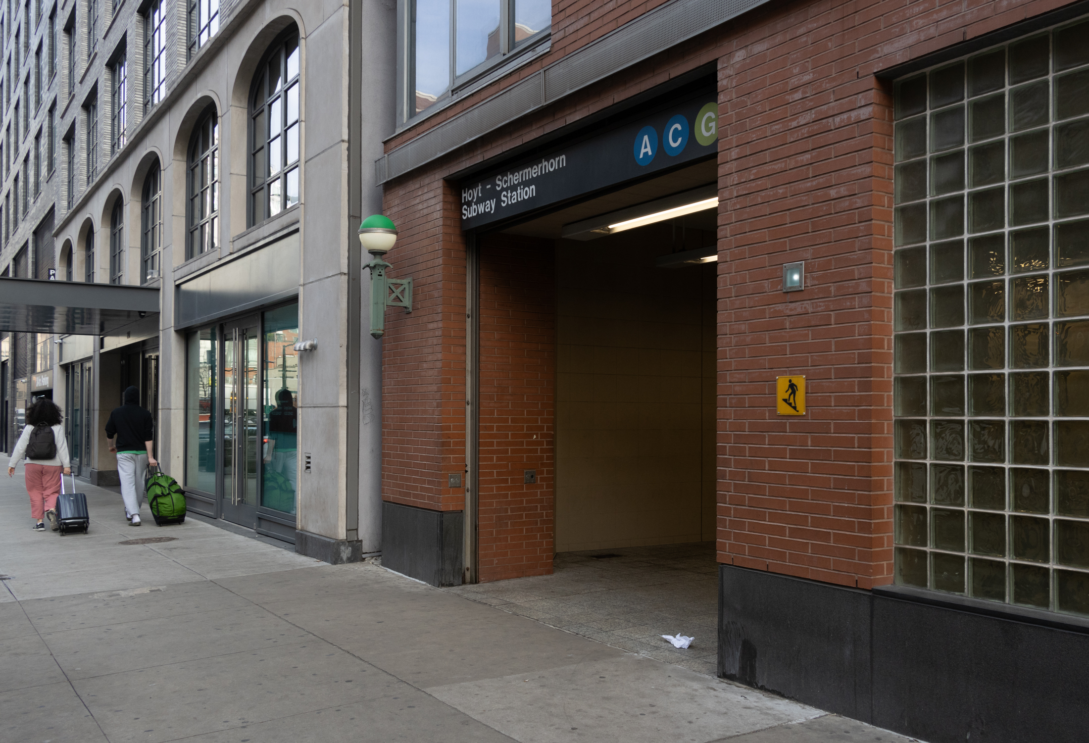 people walking near the entrance to the hoyt schermerhorn station