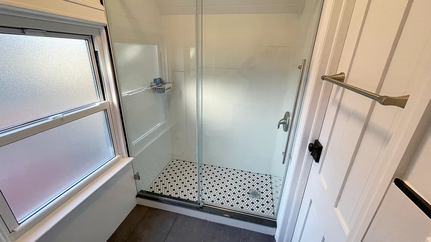bathroom with shower with glass doors