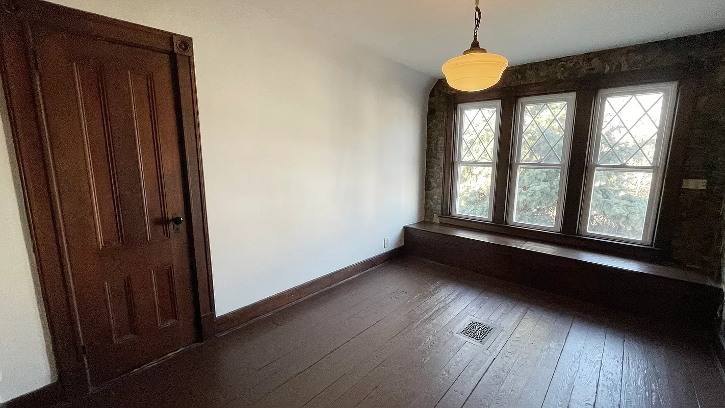 bedroom with painted wood floor