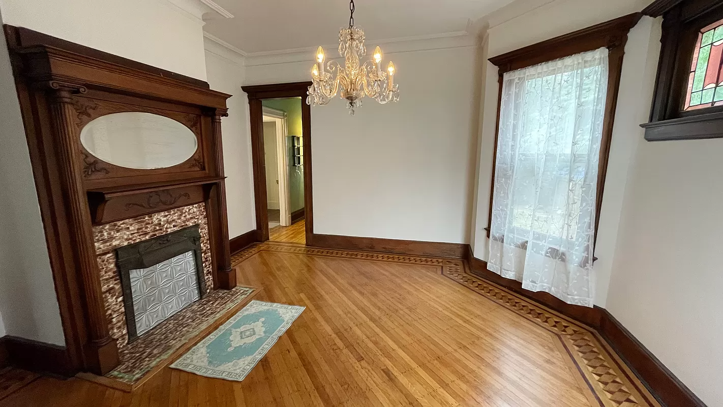 dining room with columned window and stained glass window