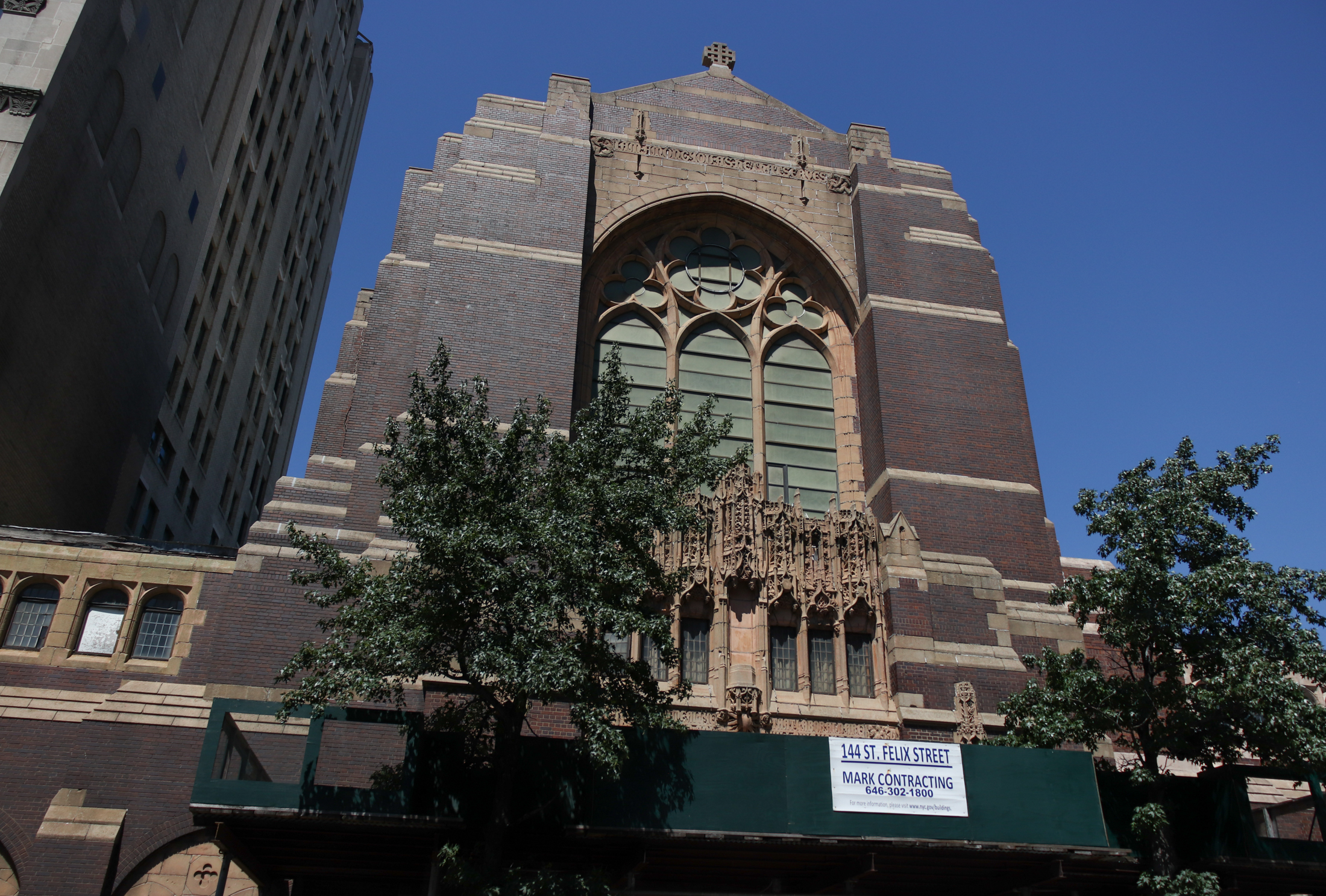 the dark brick neo-gothic style church