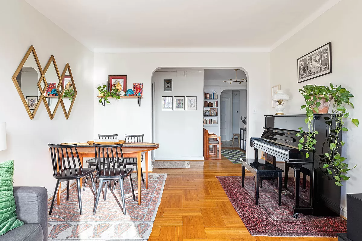 view from living room to arched doorway to foyer