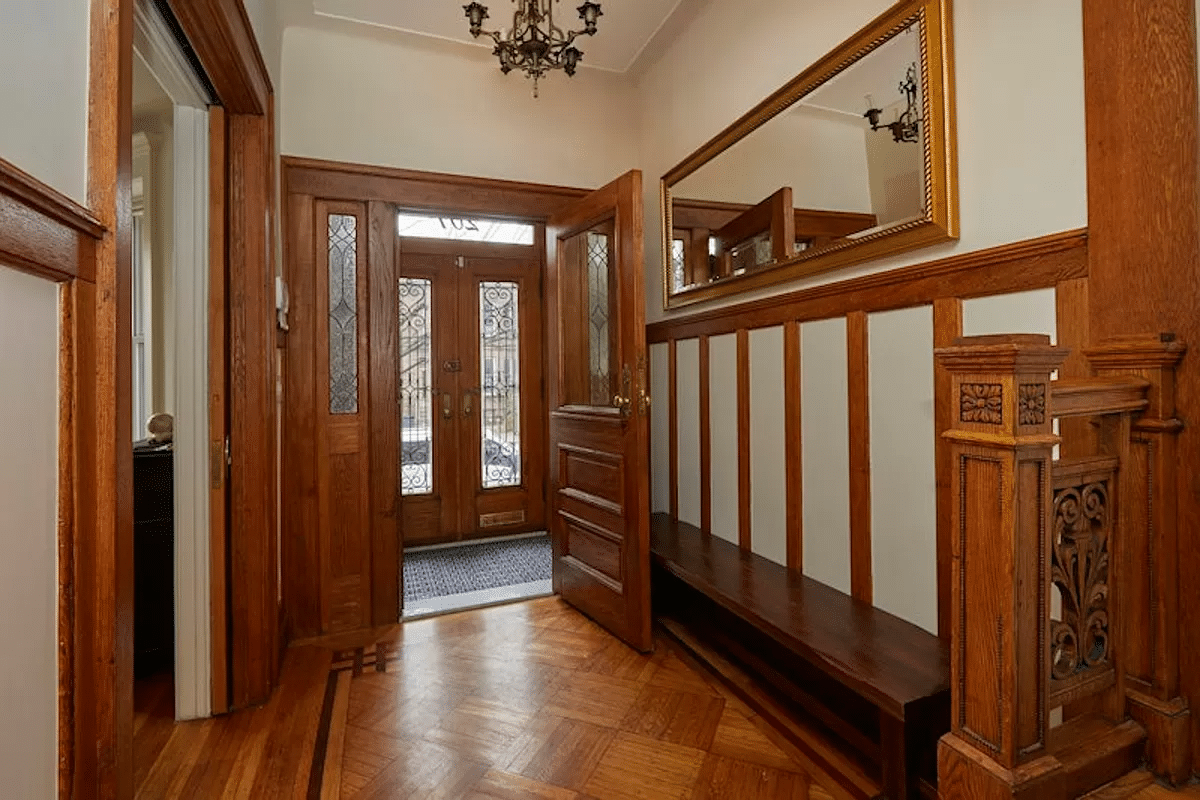 entry with view to front door with leaded glass sidelights