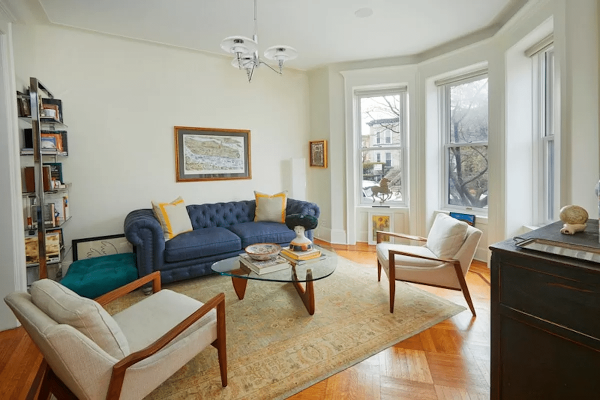 parlor with wood floor and white walls and trim