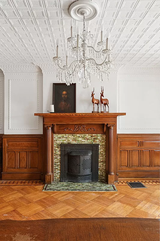 columned mantel and tin ceiling in the garden level dining room