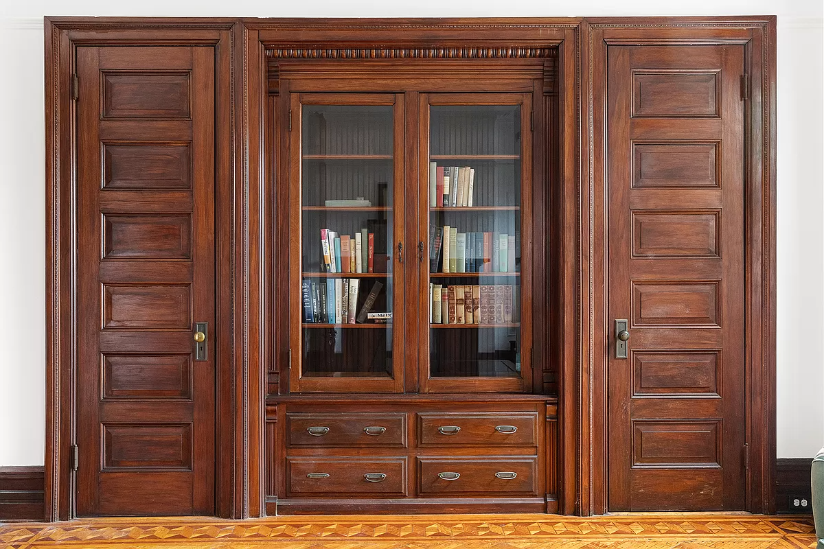 built-in in rear parlor with glass doors