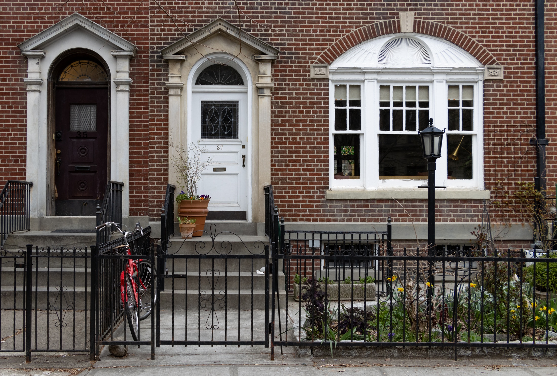 brooklyn - a stoop with flowers and a bike