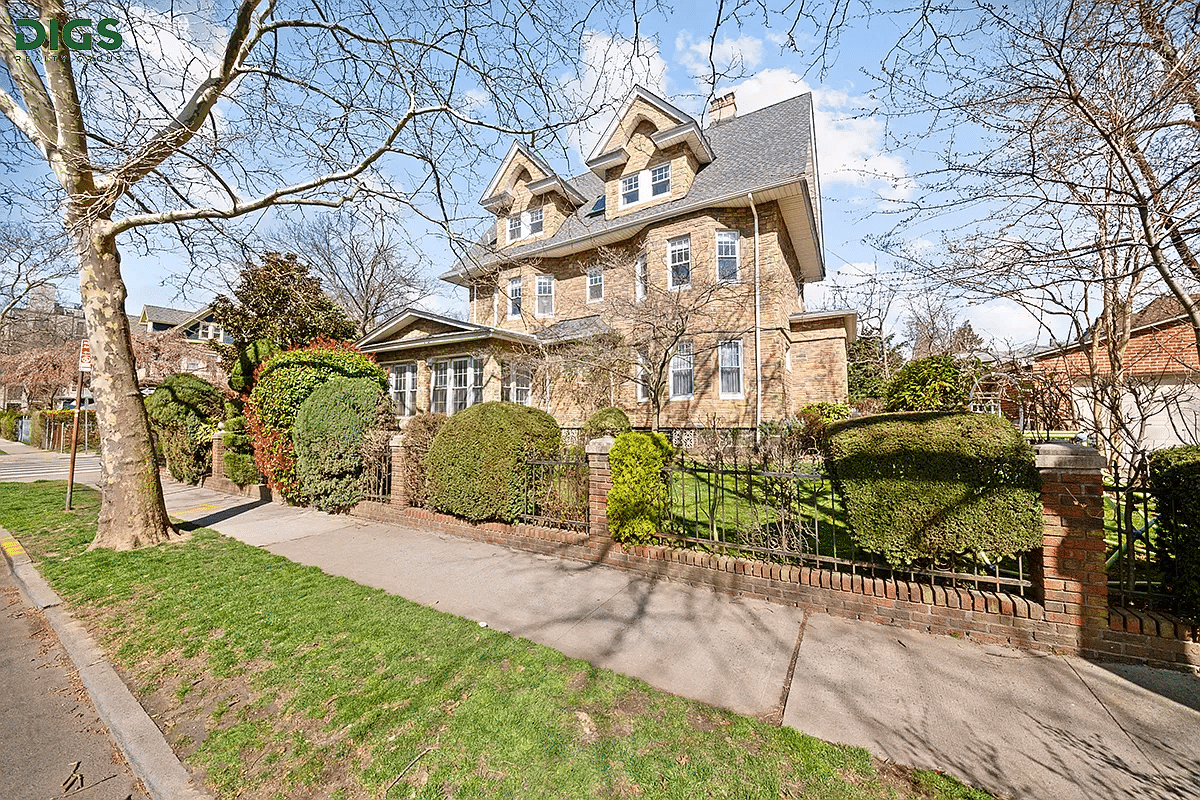 exterior with permastone facade and a large yard