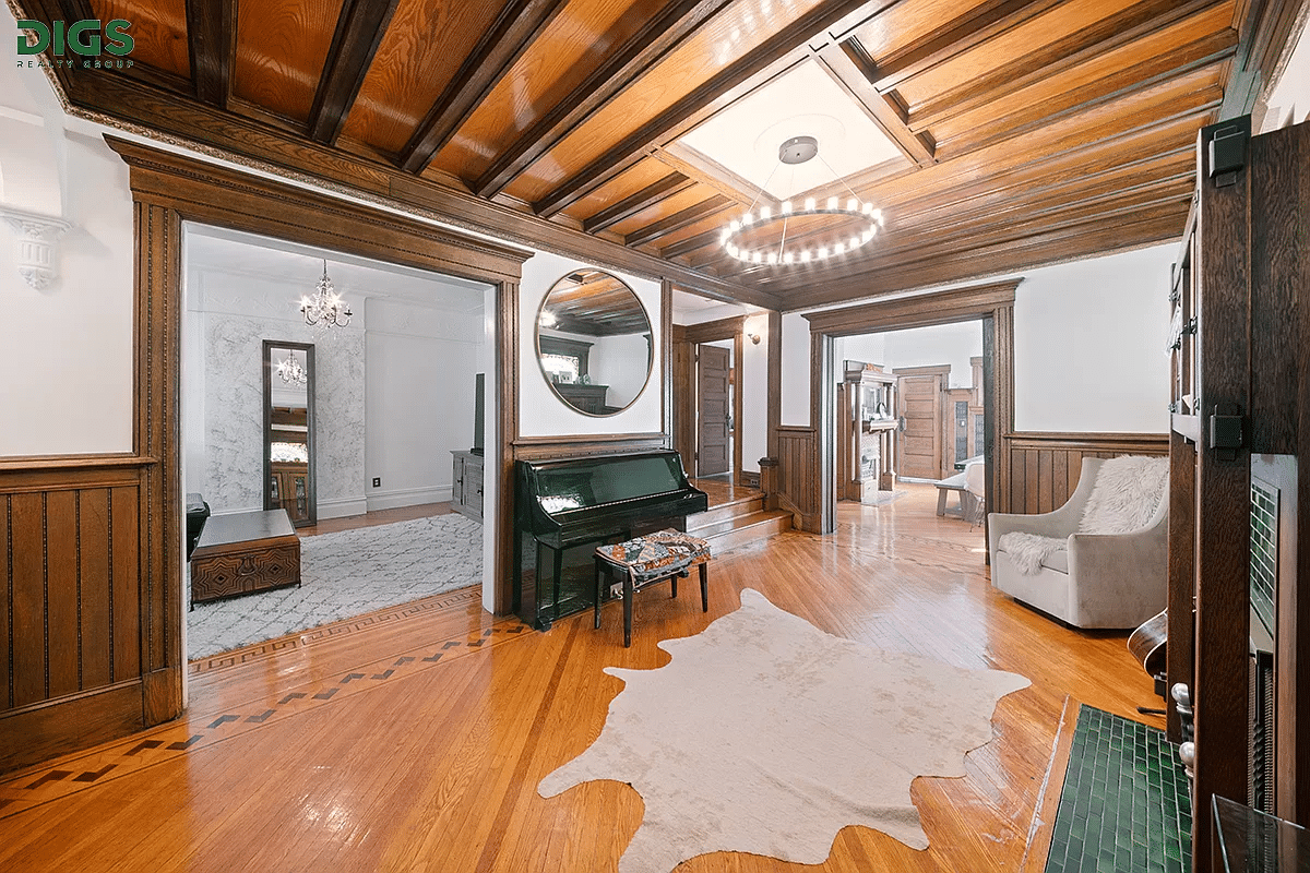 south midwood - middle parlor with beamed ceiling and a mantel