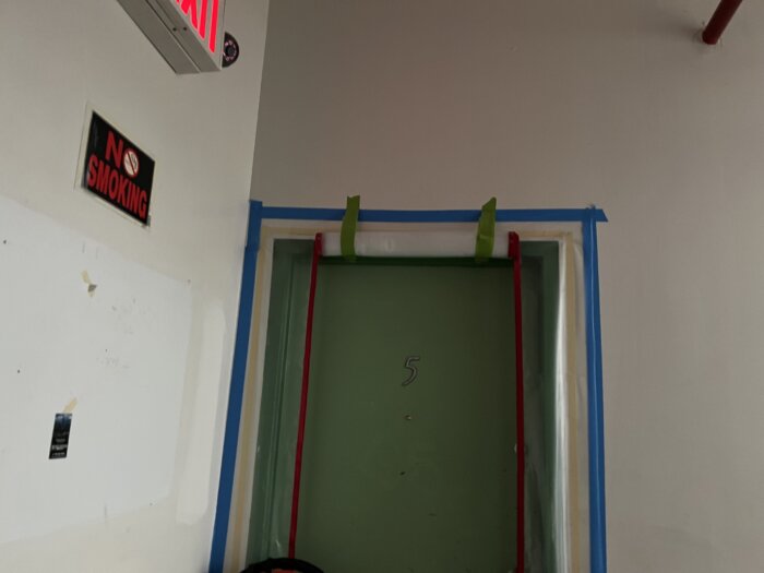 doorway with a green dust protector
