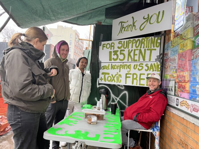 tenants with thank you signs and a table