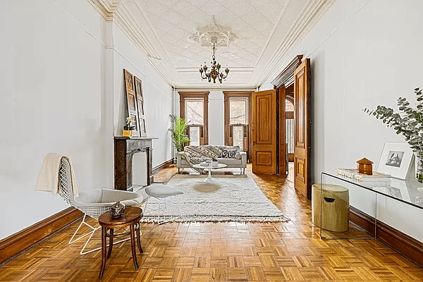 bed stuy parlor with wood floor, ceiling medallion and mantel